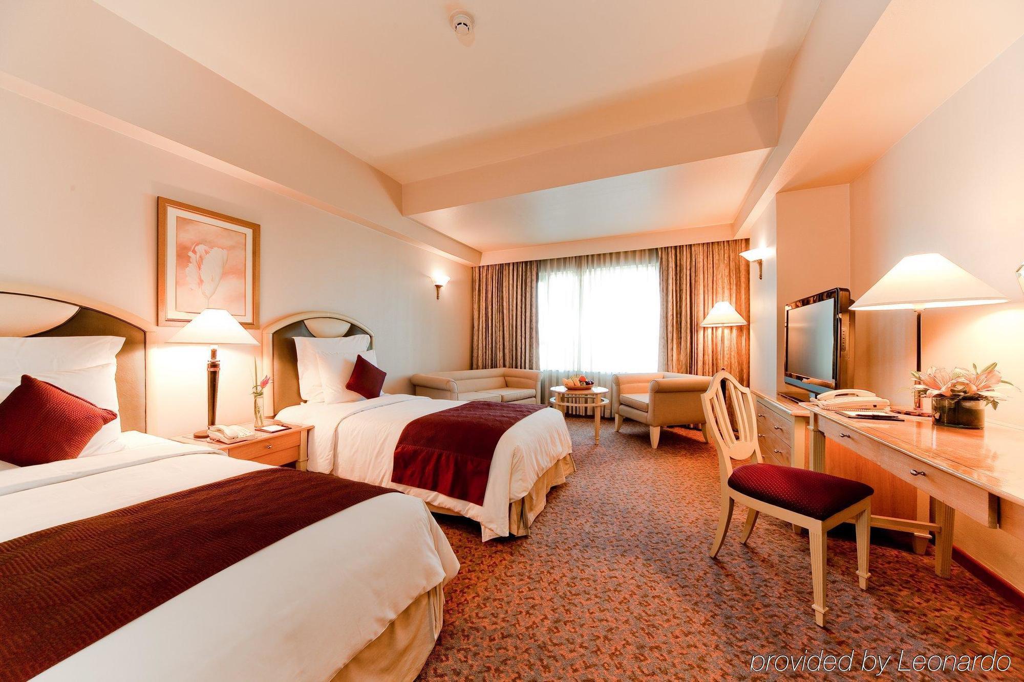 فندق فندق نيو وورلد ماكاتي، مانيلا الغرفة الصورة